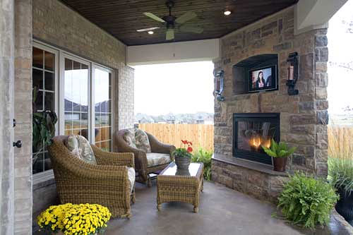 Covered patio with stone fireplace