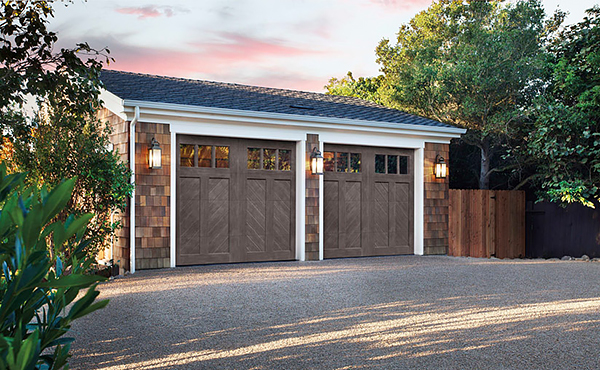 A Detached Garage with Two Faux Wood Chevron Garage Doors