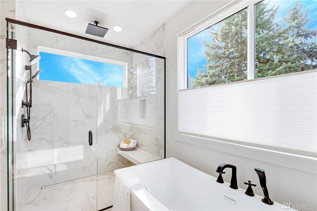 A garden tub and stall shower with plenty of natural light.