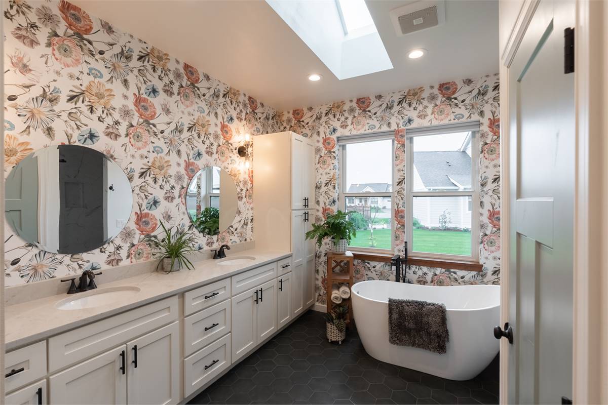 Stylish transitional bathroom with wallpaper