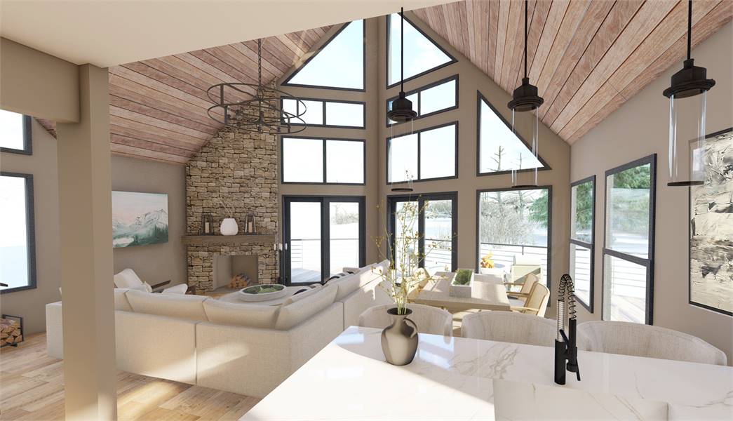 the inside view looking out of the vaulted great room of a mountain house plan