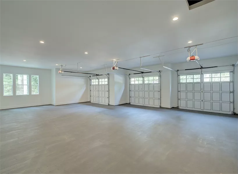 inside of one of our great garages with three bays and parking for four