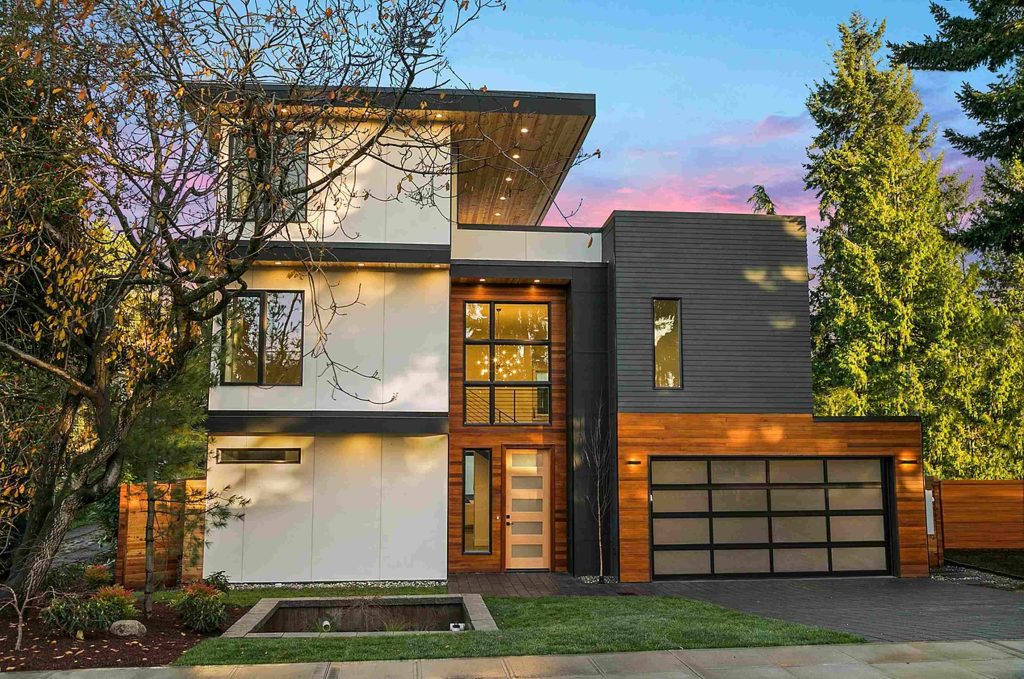 a three-level modern home with a rooftop deck off the third floor