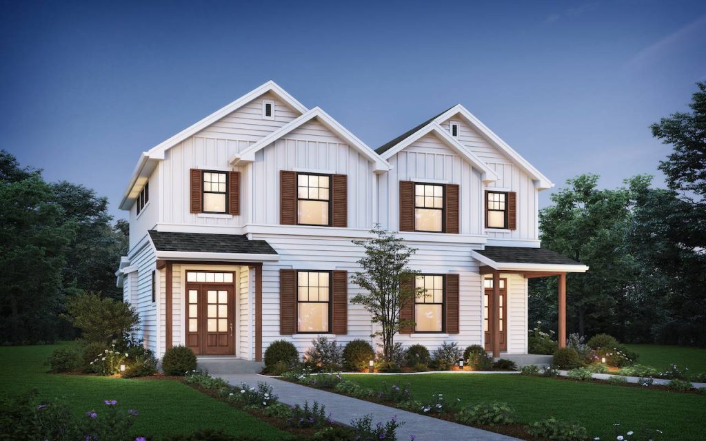 a two-story farmhouse-style duplex with side-by-side units