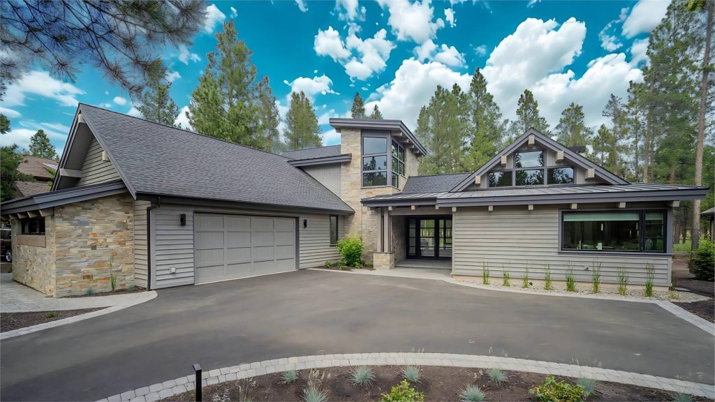 a dramatic contemporary home with an H-shaped layout, split bedrooms, a courtyard-entry garage, and an actual courtyard in back