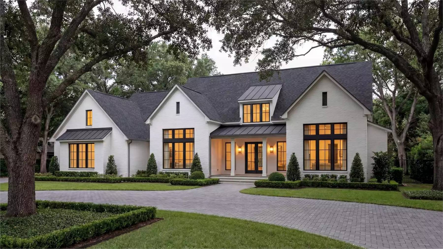 a luxurious modern farmhouse ranch with a formal dining room sure to appeal to families looking for a spacious home with traditional appeal