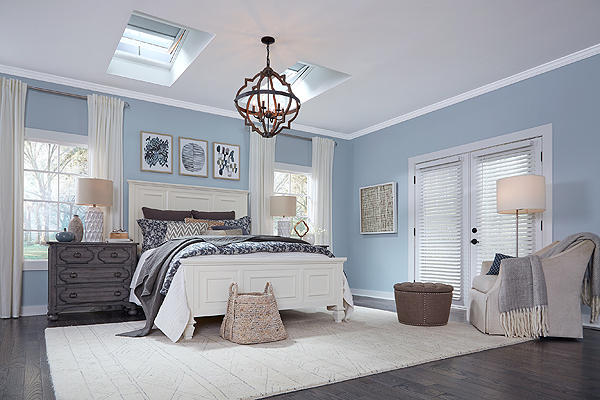 A Bedroom with Operational Skylights with Blinds Overhead