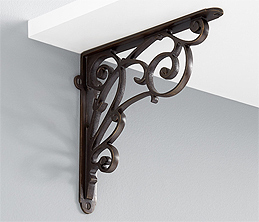 A Swirly Brass Shelf Bracket in a Beautiful Dark Finish