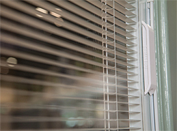 Internal Blinds Sandwiched Between Panes of Glass with Cordless Operation