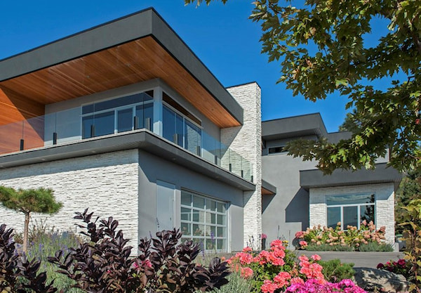 A Striking Modern Home with White Ledgestone Accents on the Exterior