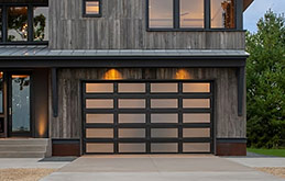 A Modern Garage Door with a Grid of Steel and Glass Panes for a Dramatic Look