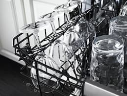A Dishwasher with Adjustable Racks to Accommodate Wine Glasses, Cups, and Other Delicate Items