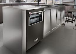 An Integrated Dishwasher with a Lighted Interior and a Window to See Inside