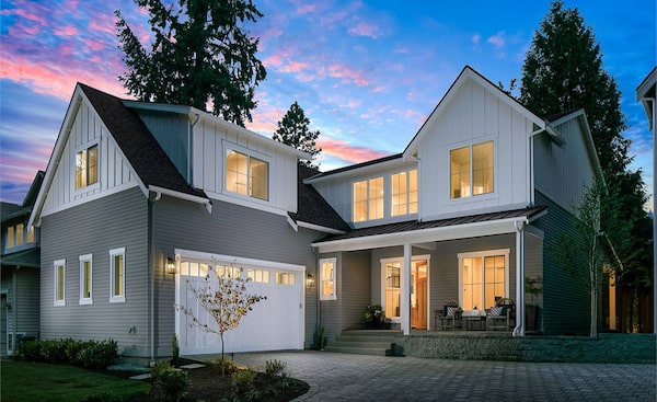 The Facade of a Stunning Two-Story Farmhouse with a Front Side-Entry Garage