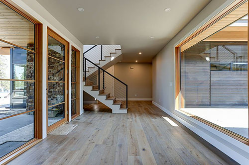 The Foyer in an H-Shaped Contemporary Home with Tons of Light, Split Bedrooms, and a Courtyard