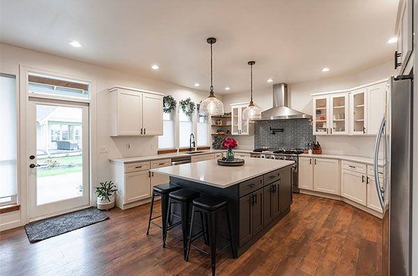 A Two-Story Modern Farmhouse with a Beautiful U-Shaped Kitchen and Main Level Master Suite