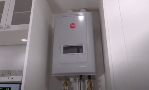 A Wall-Mounted Tankless Water Heater in a Laundry Room