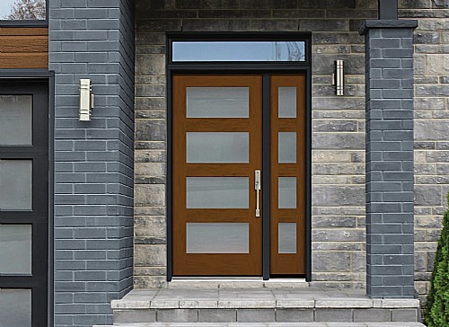 A Neutral Modern Exterior with Natural Elements Including Stone and a Wood-Look Door
