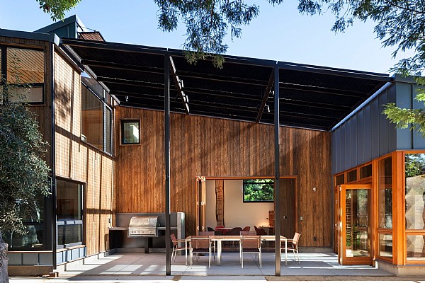 A Modern Outdoor Living Space Backed by a Wall of Chic Natural Cladding