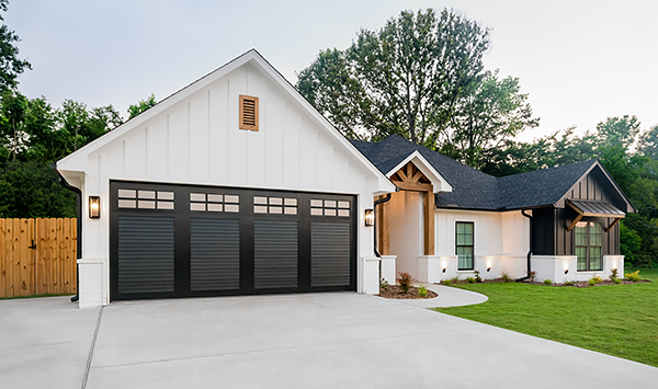 A Black Louver Garage Door on a Chic Black-and-White Modern Farmhouse Ranch