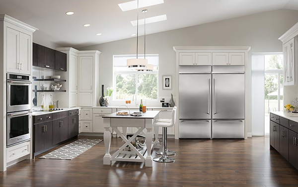 A Spacious Kitchen with Two Built-In Bottom-Freezer Fridges Installed Side by Side