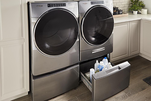 A Front-Loading Laundry Set on Pedestals for Storage and Convenience