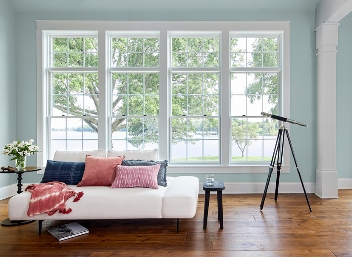 A Lake Home with Sash and Transom Windows with Traditional Grilles