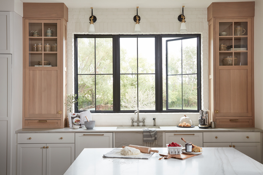 A Trio of Large Windows with Lites Behind a Kitchen Sink