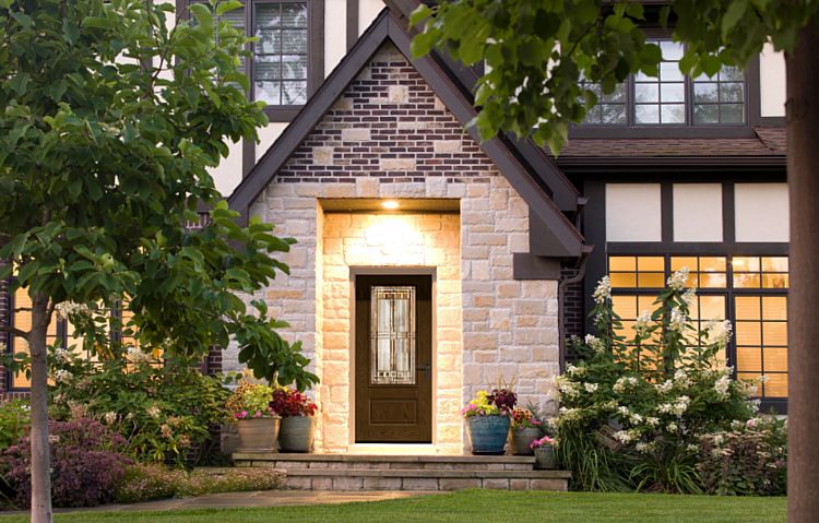 A Wood-Look Door with Decorative Glass on a Tudor-Style Home