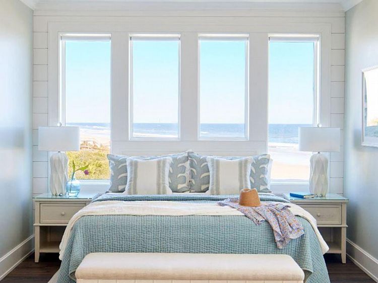 A Beachside Bedroom with Water Views Through Vinyl Windows