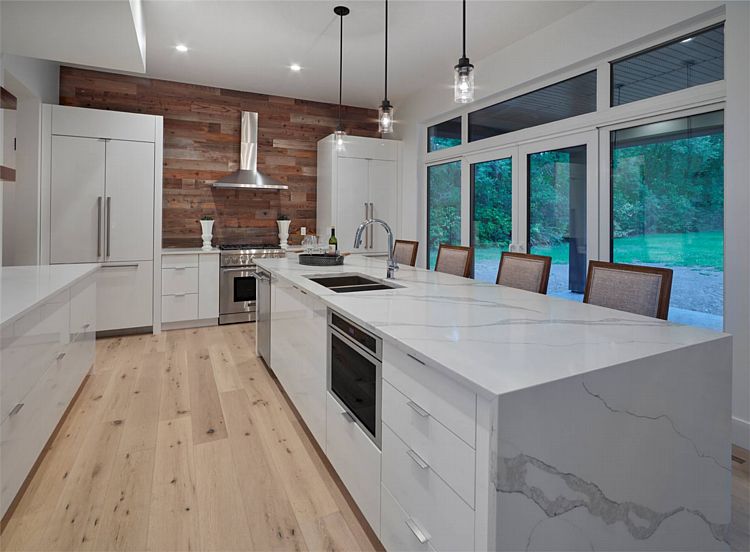 The Island Kitchen in a Two-Story Contemporary Home with Sunny Spaces