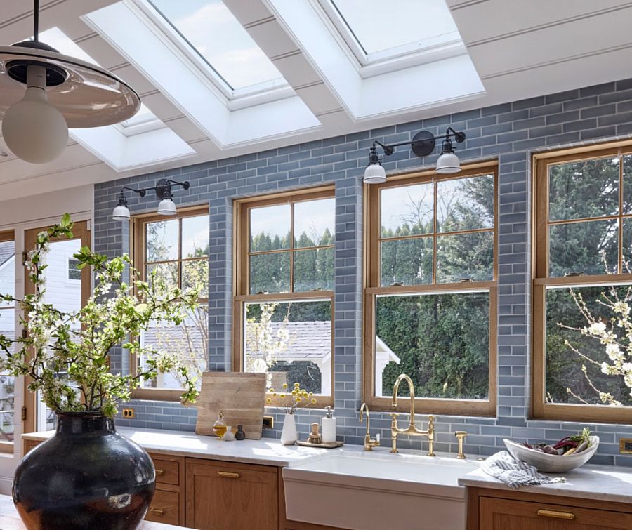 A Beautiful Kitchen with Blue Tile, Wood Windows and Cabinets, and Skylights Above (Emily Henderson)