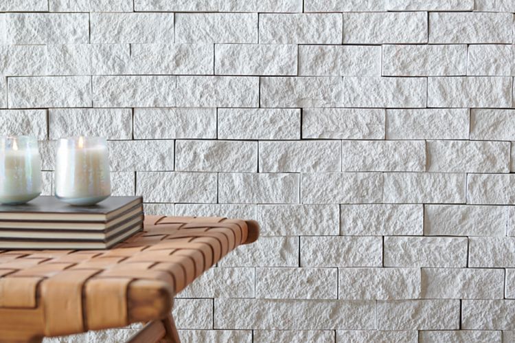 A Wall of Textured Stone with Crisp Clean Edges in an Offwhite Color