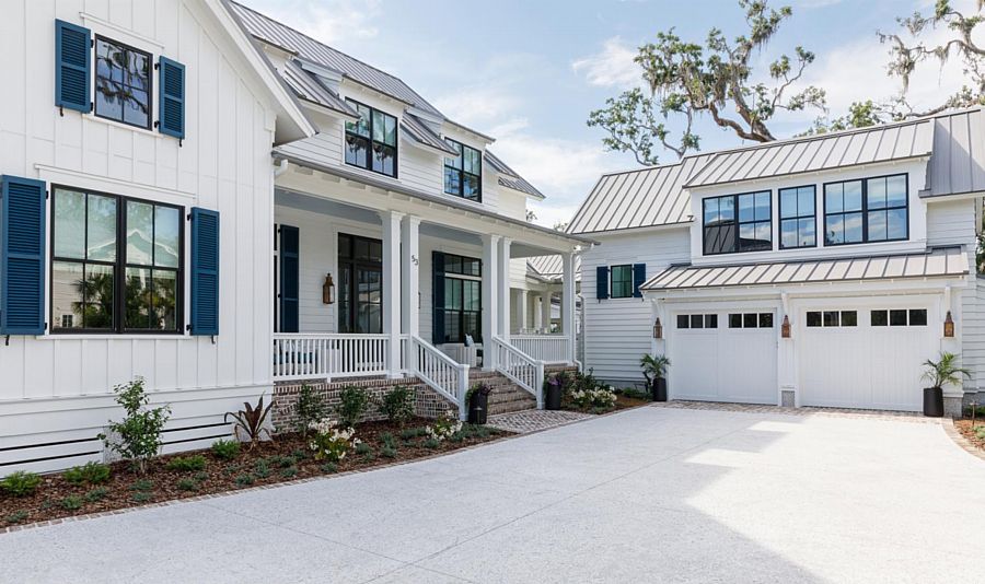 A Beachy White Farmhouse with Striking Black Windows and Blue Shutters