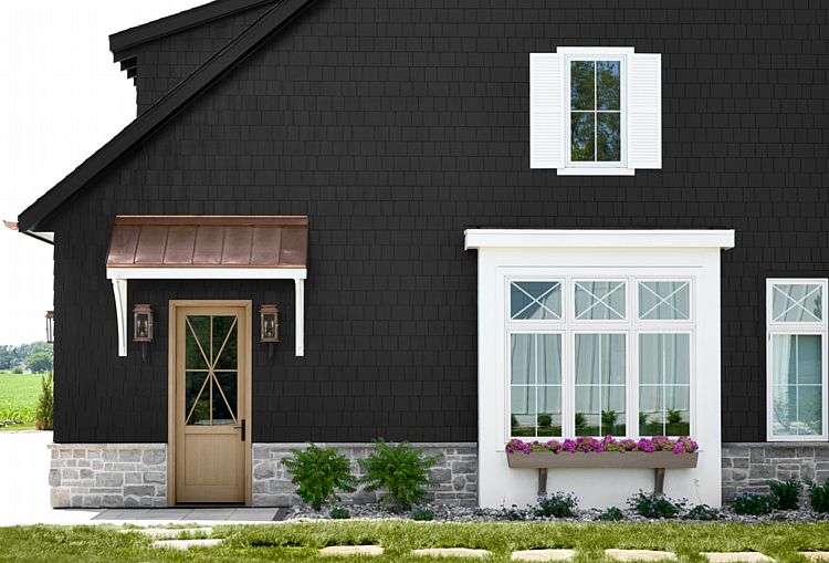 A Chic Black Shingle Cottage with a Wood Door and Striking White-Framed Picture Windows with Lites
