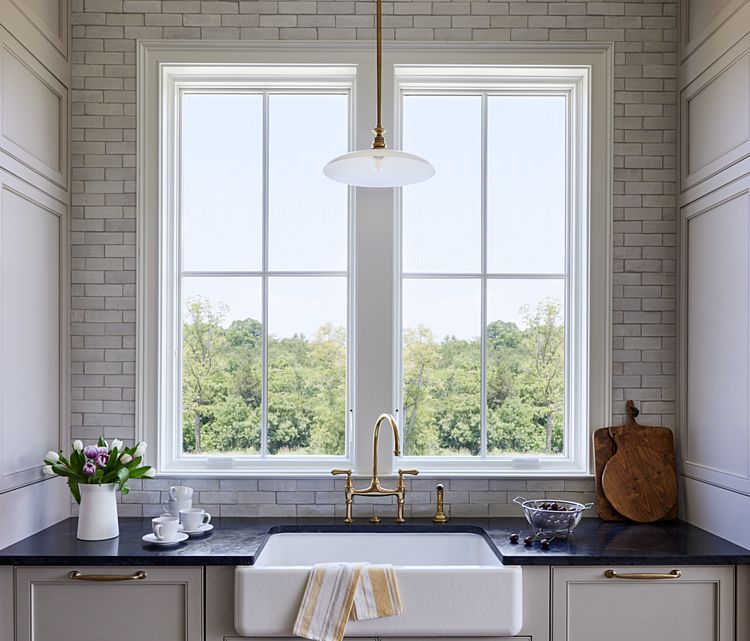 A Kitchen Sink with Beautiful Views Out Through Large Casement Windows