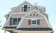 A Synthetic Shingle Product with Deep Natural Grain Texture Still Visible Under Paint