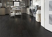 A Hard-Wearing Engineered Vinyl Plank Flooring with a Dark Color and 50 Year Warranty