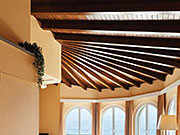 A Stunning Sun Room with a One-of-a-Kind Ceiling Thanks to a Curving Beam Look