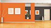 A Living Room with a Striking Orange and Black Palette That Is Warm and Balanced